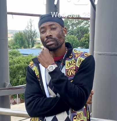 B.E. Mhlanga walking outdoors