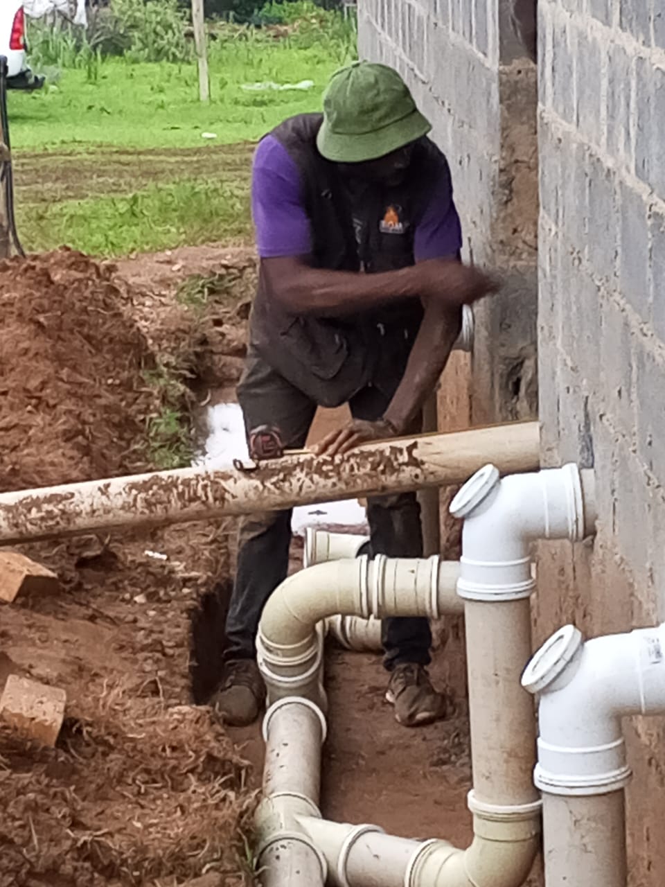 Worker on plumbing site